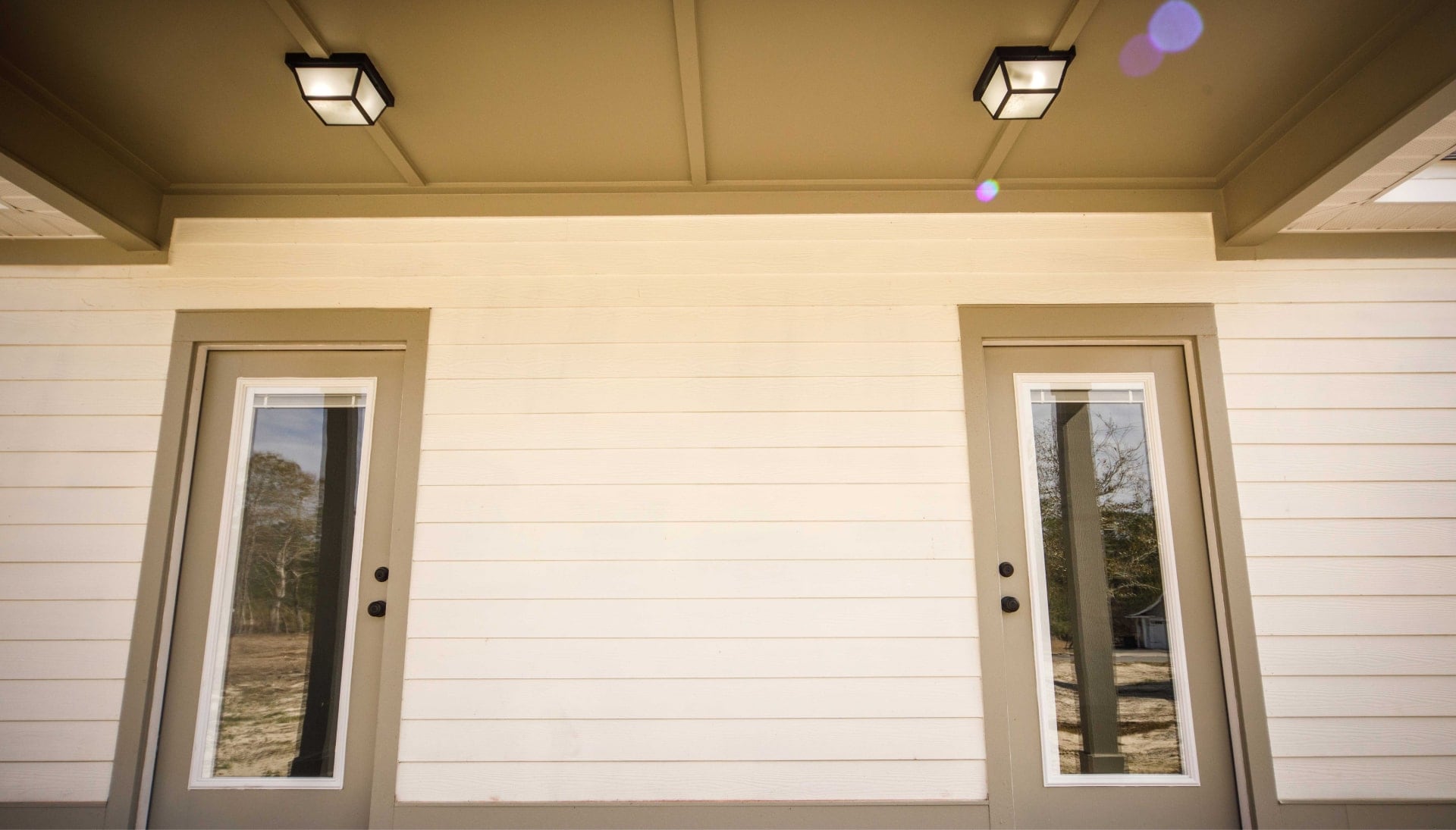 We offer siding services in Rochester, Minnesota. Hardie plank siding installation in a front entry way.